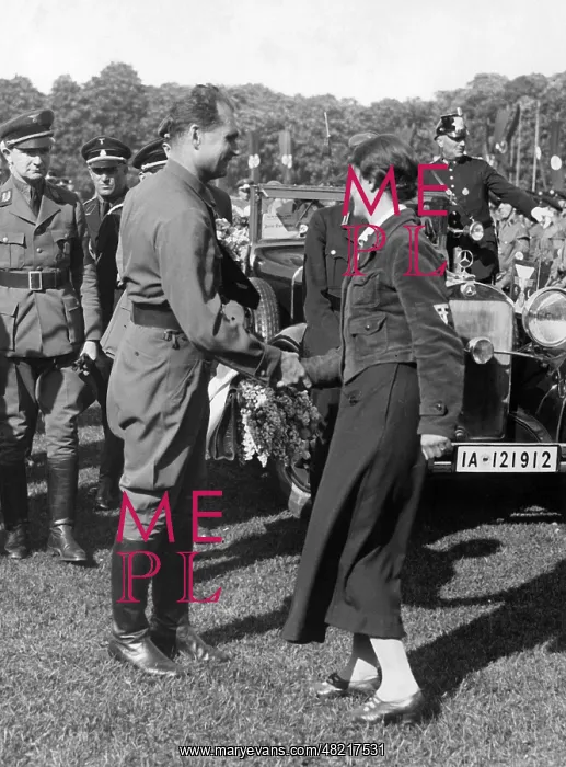 : Rudolf Hess is given flowers at his arrival, 1935 : Rudolf Hess is given flowers at his arrival, 1935