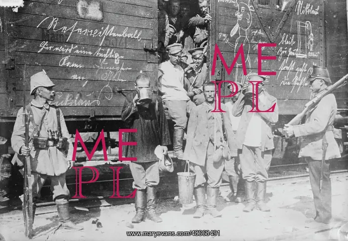 : Russian prisoners drinking from large cups by : Russian prisoners drinking from large cups by