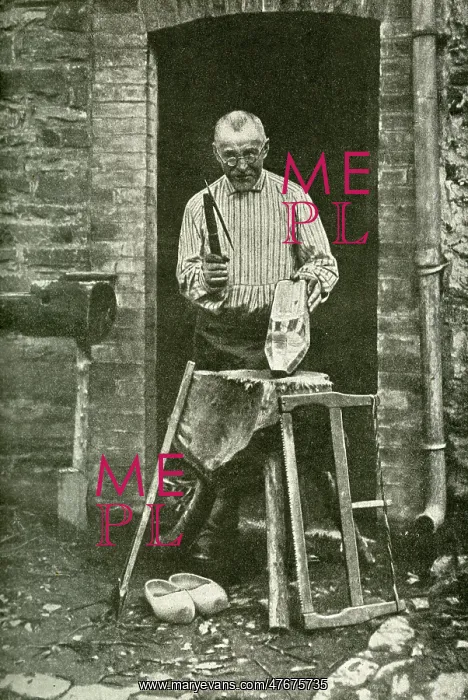 : Sabot maker working at his cottage door, Belgium : Sabot maker working at his cottage door, Belgium