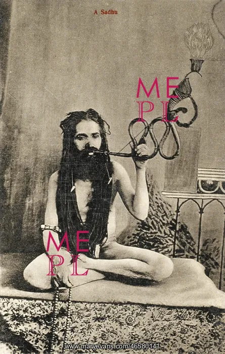 : A Sadhu smoking a remarkable pipe, India : A Sadhu smoking a remarkable pipe, India