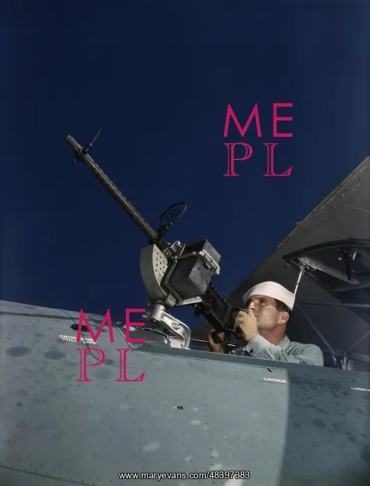 : Sailor tries out a.30-caliber machine gun : Sailor tries out a.30-caliber machine gun