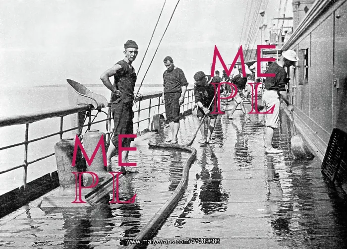  : Sailor washing down decks on the U.S.S. Yankee