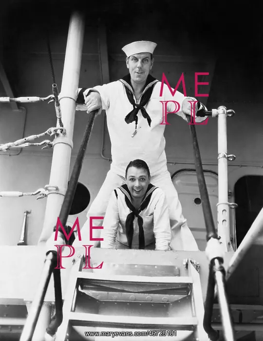 : Two sailors standing on a gangway : Two sailors standing on a gangway