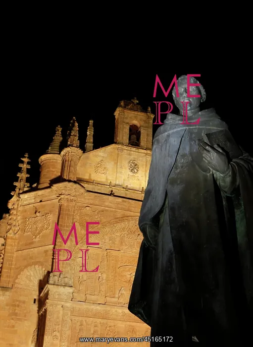 : Salamanca. Low angle view of statue of Padre Vitoria, outside the Convent of St : Salamanca. Low angle view of statue of Padre Vitoria, outside the Convent of St