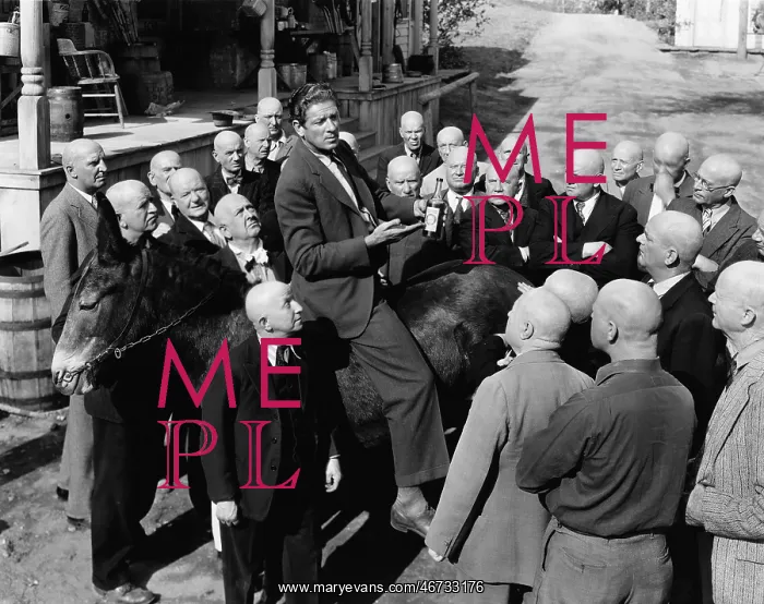 : Salesman on donkey with group of bald men : Salesman on donkey with group of bald men