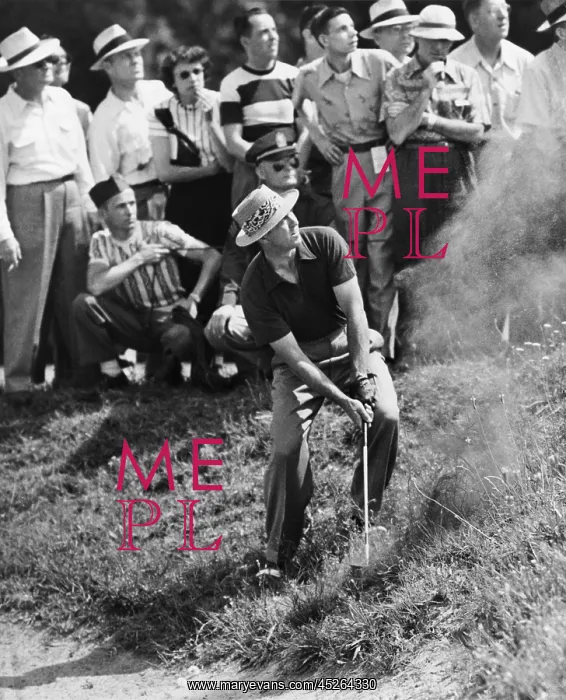 : Sam Snead makes an iron shot from the side of a : Sam Snead makes an iron shot from the side of a