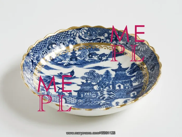 : Saucer made from porcelain, transfer-printed in underglaze blue with the