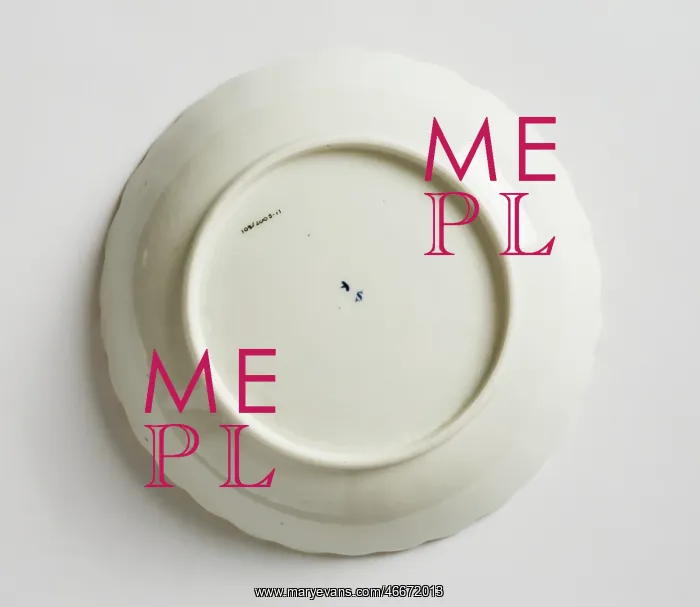  : Saucer made from porcelain, transfer-printed in underglaze blue with the