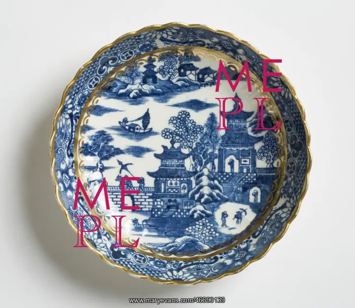  : Saucer made from porcelain, transfer-printed in underglaze blue with the