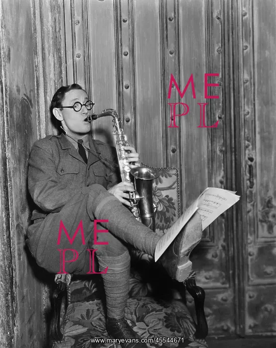 : Saxophone player reading music on foot : Saxophone player reading music on foot