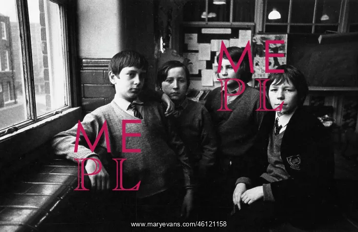: Four schoolboys in a classroom : Four schoolboys in a classroom