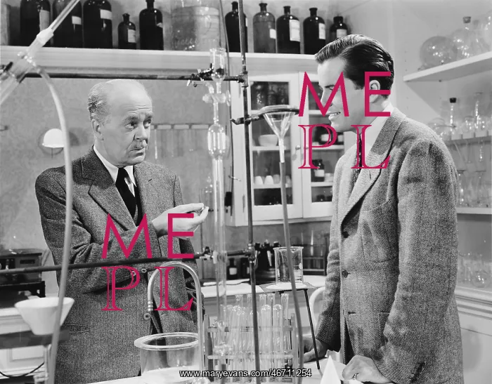 : Scientist discussing the secret ingredient in the laboratory : Scientist discussing the secret ingredient in the laboratory