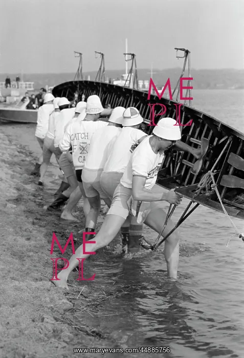 : Sculling Team Lifting Boat Into : Sculling Team Lifting Boat Into