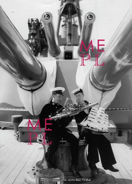 : Two seamen with model boats on the : Two seamen with model boats on the