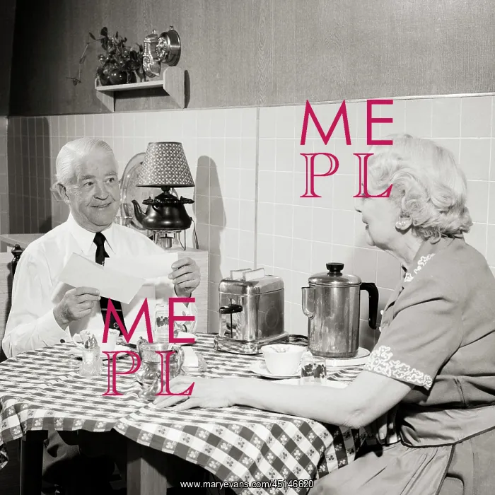 : Senior Couple Sitting at Kitchen Table Having : Senior Couple Sitting at Kitchen Table Having