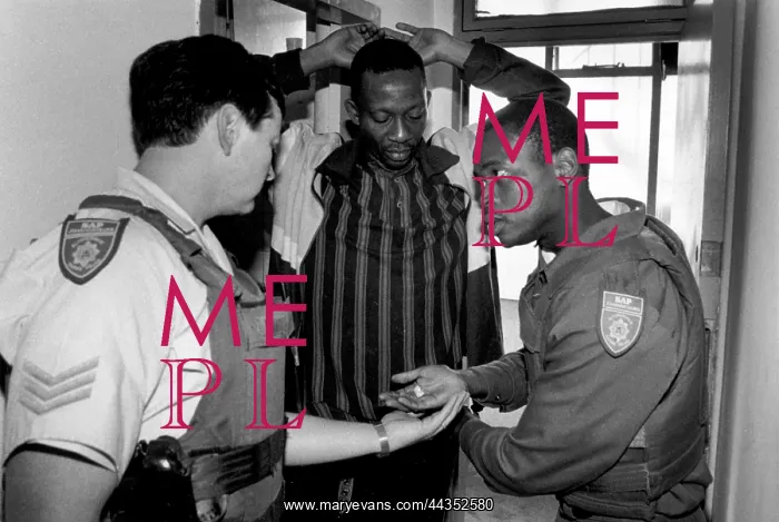 : Sergeant Stander (L) and Constable Sibanyoni check : Sergeant Stander (L) and Constable Sibanyoni check