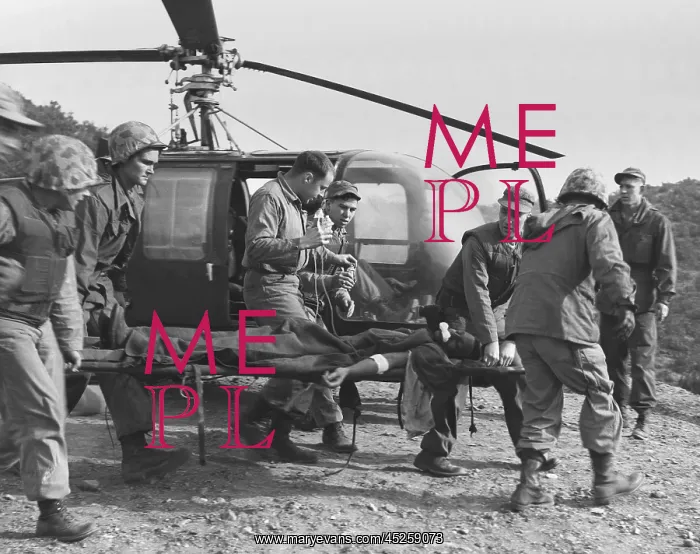 : A seriously wounded U.S. Marine is rushed to helicopter : A seriously wounded U.S. Marine is rushed to helicopter