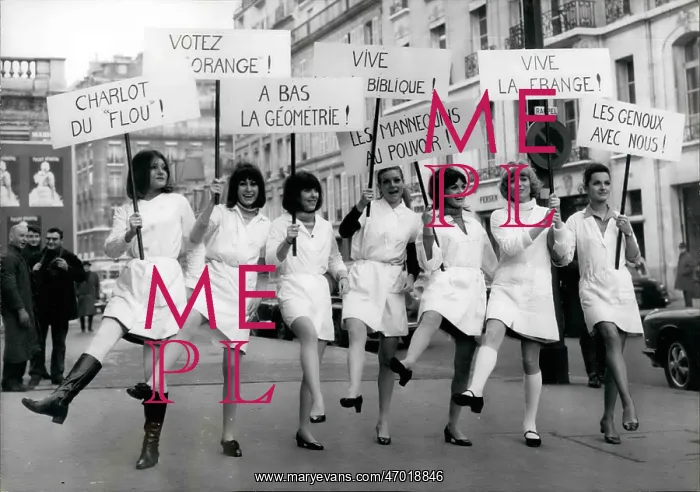 : Seven Jacques Esterel models with comic placards in Paris : Seven Jacques Esterel models with comic placards in Paris
