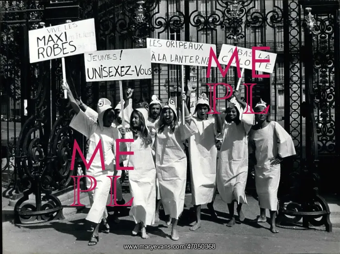 : Seven Jacques Esterel models with comic placards in Paris : Seven Jacques Esterel models with comic placards in Paris