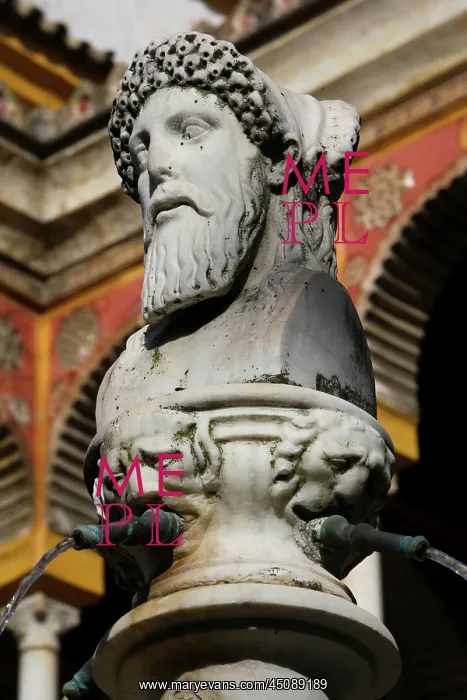 : Seville. Low angle view of a detail of the fountain statue : Seville. Low angle view of a detail of the fountain statue