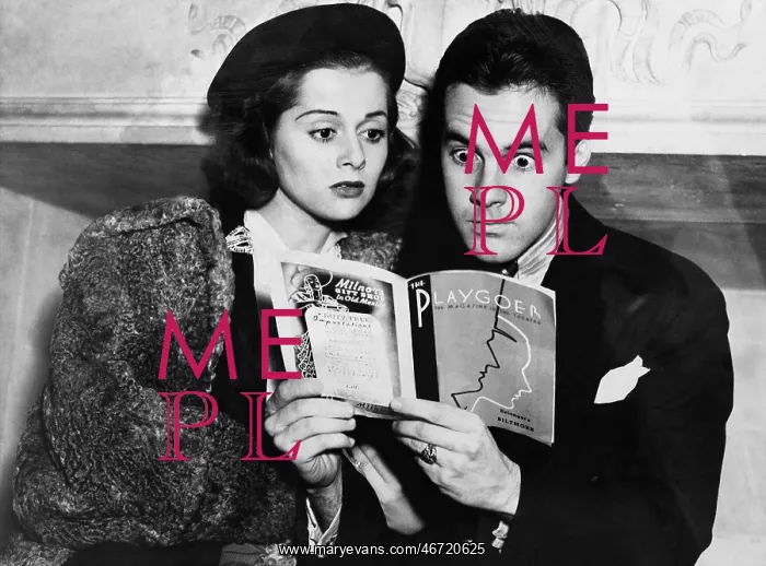 : Shocked couple reading together : Shocked couple reading together