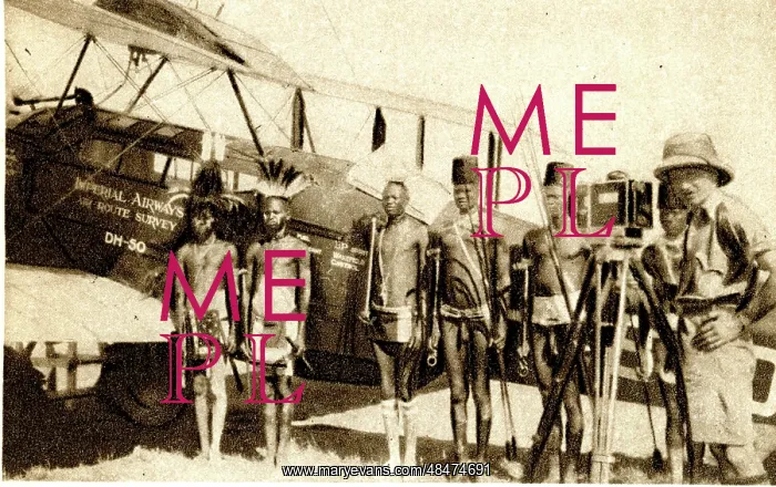 : Shulluk warriors pose by Alan Cobham's aeroplane, Sudan : Shulluk warriors pose by Alan Cobham's aeroplane, Sudan