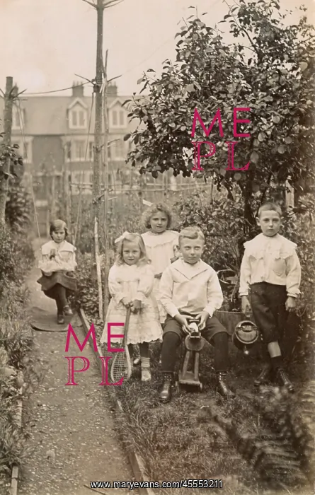  : Five siblings playing in their suburban garden