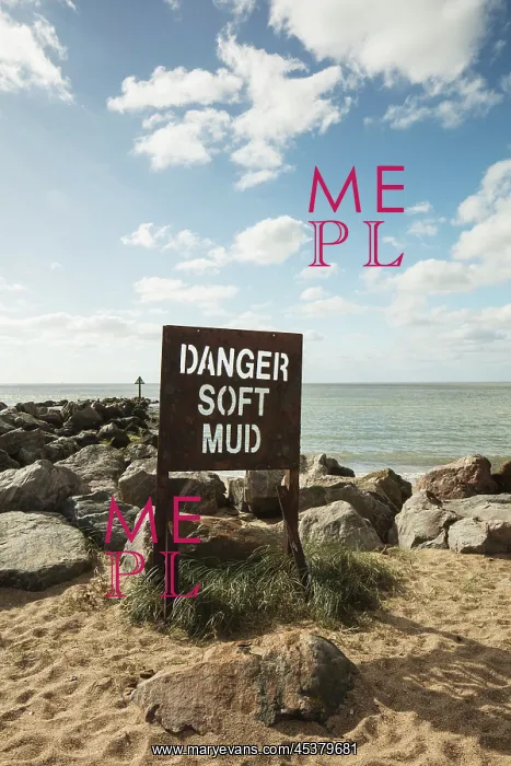 : Sign on the beach reading Danger Soft Mud : Sign on the beach reading Danger Soft Mud