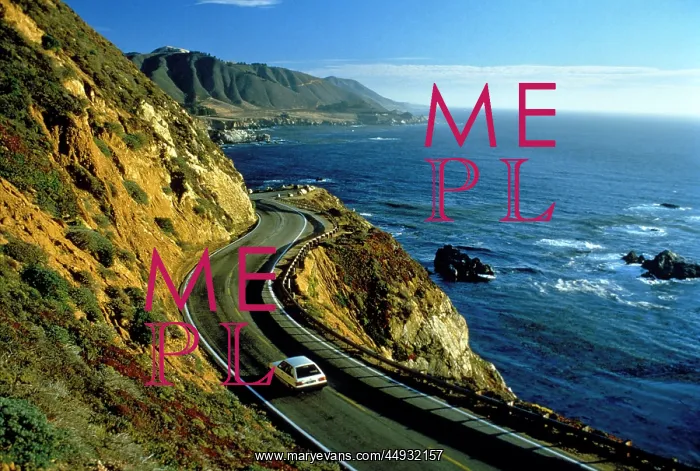  : Single White Compact Car Driving Along Coast Highway Betwe