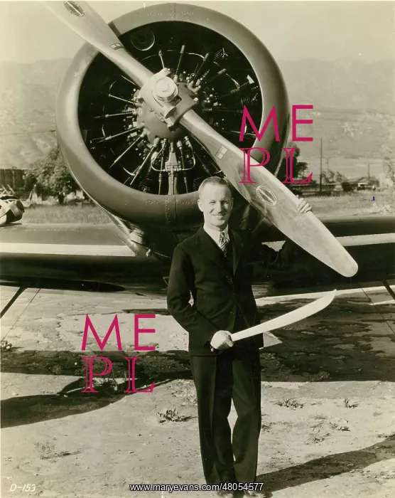 : Sir Charles Kingsford Smith in front of his Lockheed Altair : Sir Charles Kingsford Smith in front of his Lockheed Altair