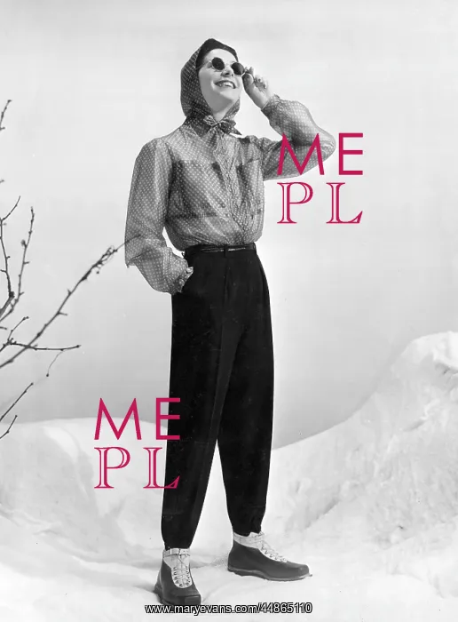  : SKI-WEAR. Womens skiing suit composed of dark woollen trousers worn with