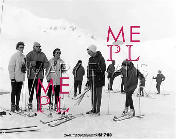 : SKIERS. Skiers congregate at the top of the slope : SKIERS. Skiers congregate at the top of the slope