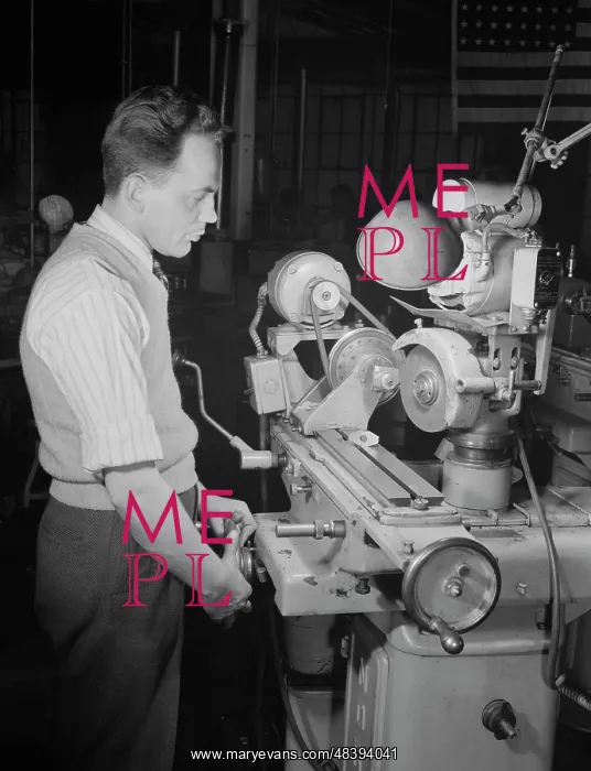 : A skilled worker grinds permanent magnet rotors : A skilled worker grinds permanent magnet rotors
