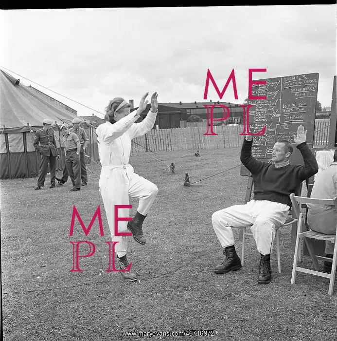 : Sky diver practising in a field : Sky diver practising in a field