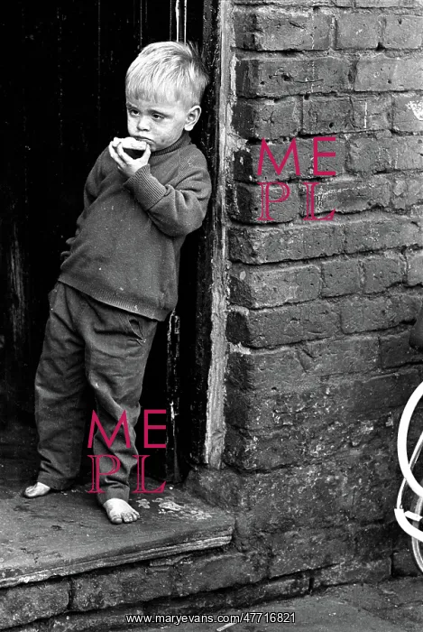 : Slum child eating : Slum child eating