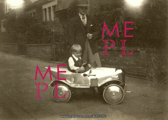 : Small boy with chrome shiny silver pedal car : Small boy with chrome shiny silver pedal car