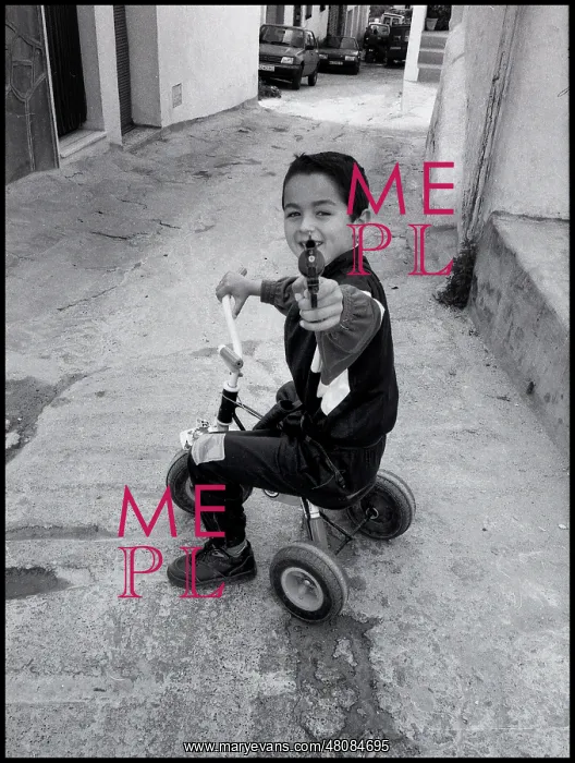  : Small boy pointing a toy gun, Malaga, Spain