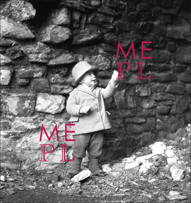 : Small boy in front of a wall : Small boy in front of a wall