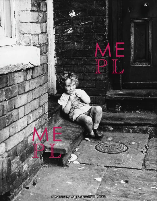 : Small child sitting in a doorway : Small child sitting in a doorway