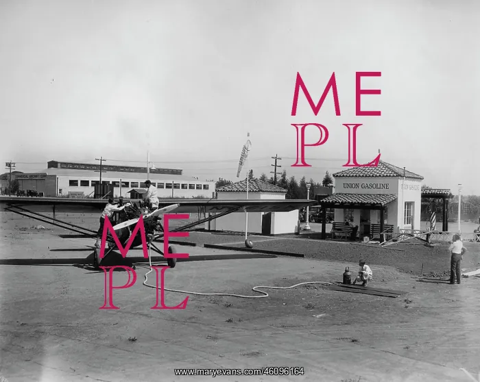 : A small plane refuels at a gas station : A small plane refuels at a gas station
