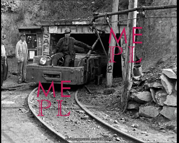: Small Train Towing Coal Wagons Coming Out of a Mine : Small Train Towing Coal Wagons Coming Out of a Mine