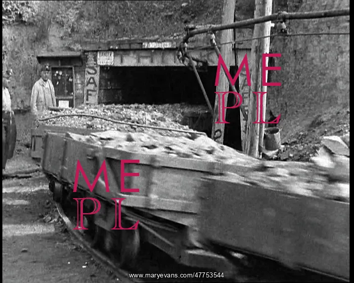 : Small Train Towing Coal Wagons Coming Out of a Mine : Small Train Towing Coal Wagons Coming Out of a Mine