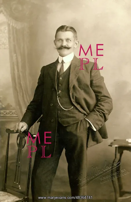  : Smartly dressed man with a magnificent moustache