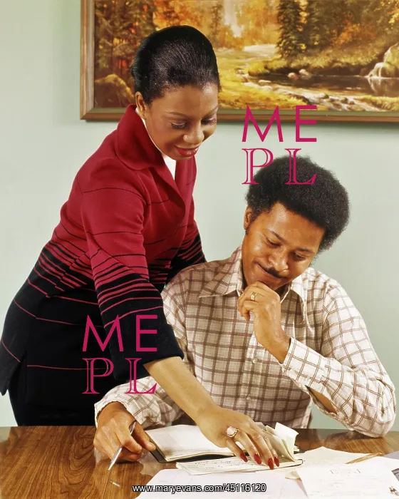 : Smiling African American Couple at Table Writing : Smiling African American Couple at Table Writing