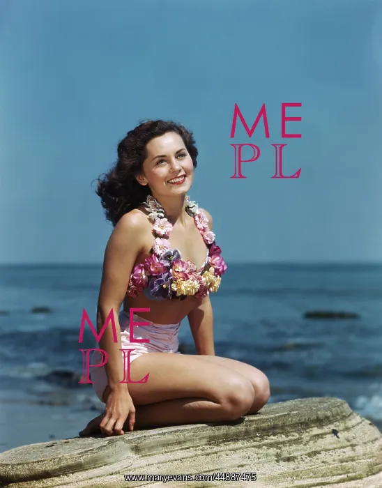 : Smiling bathing woman sitting on a rock : Smiling bathing woman sitting on a rock