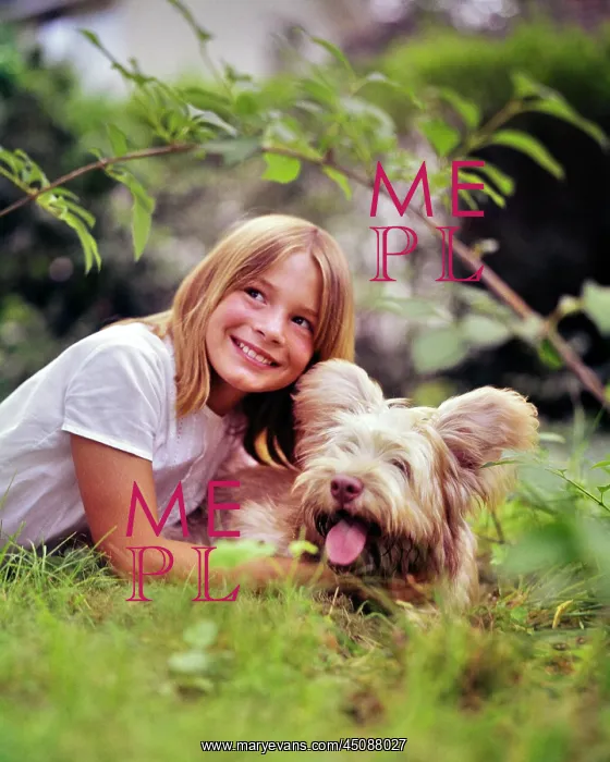 : Smiling Blond Girl Lying in Grass Playing with : Smiling Blond Girl Lying in Grass Playing with