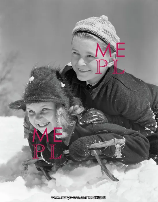 : Smiling Boy and Girl Sledding : Smiling Boy and Girl Sledding