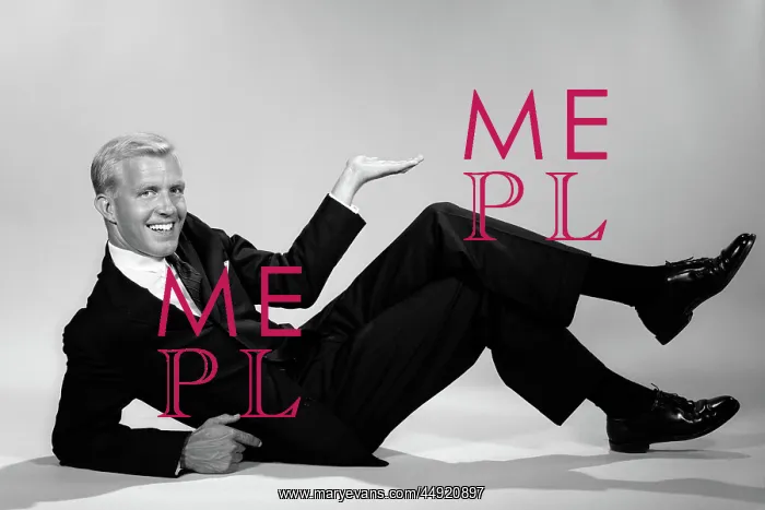 : Smiling businessman reclining propped on elbow : Smiling businessman reclining propped on elbow