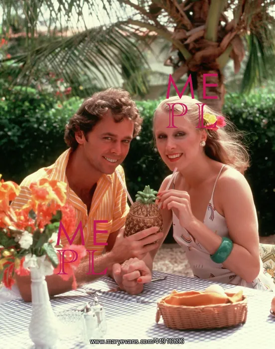 : Smiling Couple Drinking Cocktail out of a Pineapple Sha : Smiling Couple Drinking Cocktail out of a Pineapple Sha