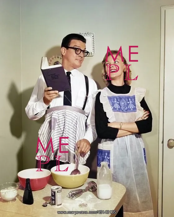 : Smiling Couple in Kitchen with Husband Learning : Smiling Couple in Kitchen with Husband Learning